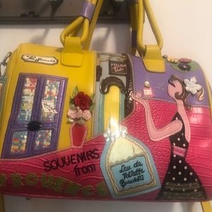 Satchel shape bag. Colorful, whimsical appliqués. Shoulder/crossbody strap.